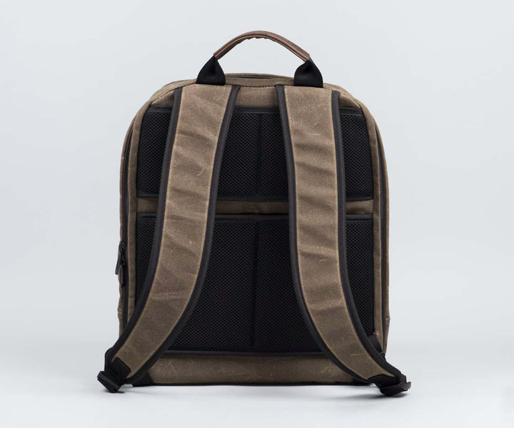 Sweat-wicking mesh back. Tuck away straps in mesh compartment.