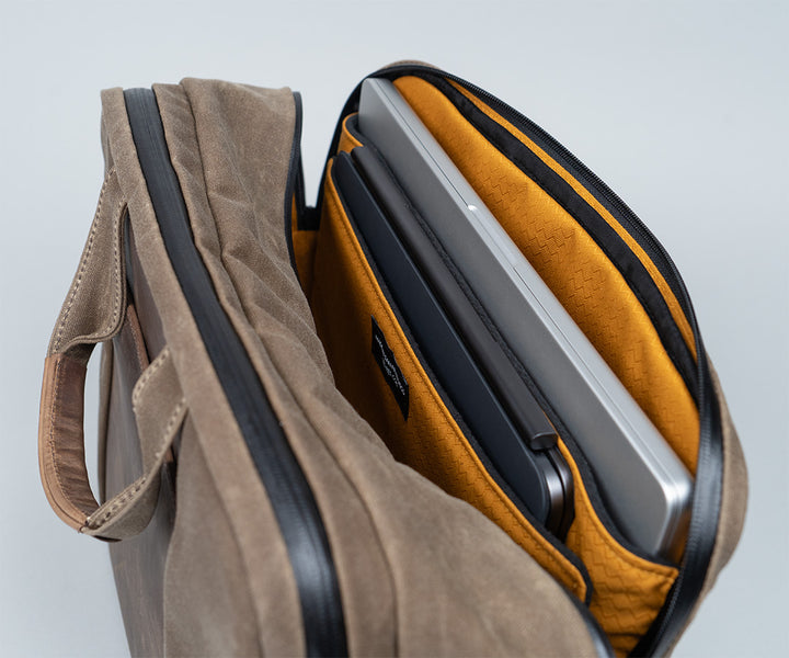 Built-in padded pockets protect two devices