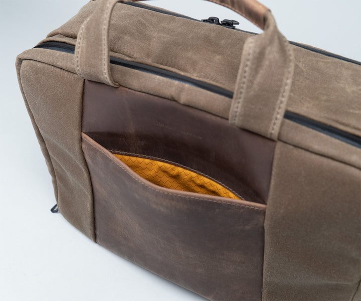 Front magnetic pocket secures frequently-used items