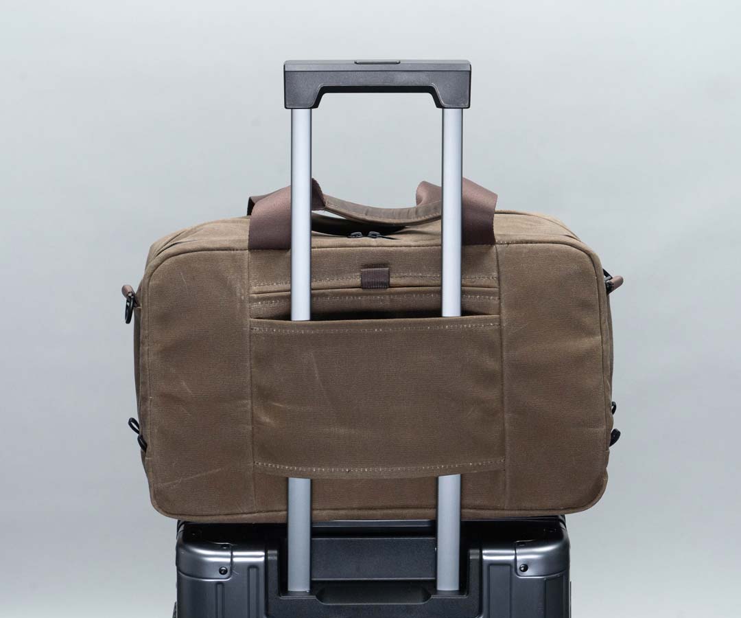 Passthrough for carry-on luggage handles