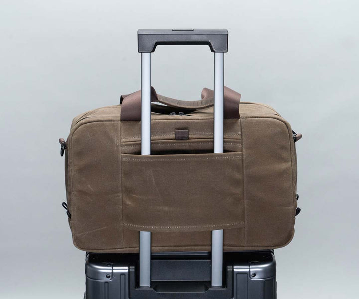 Passthrough for carry-on luggage handles