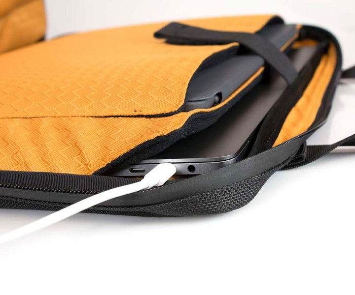 Padded pockets for laptop & tablet. In-case charging.