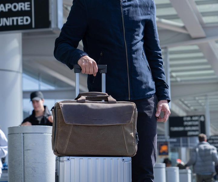 Fits on top standard carry-on luggage