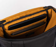 Interior gold lining. Two padded laptop compartments.