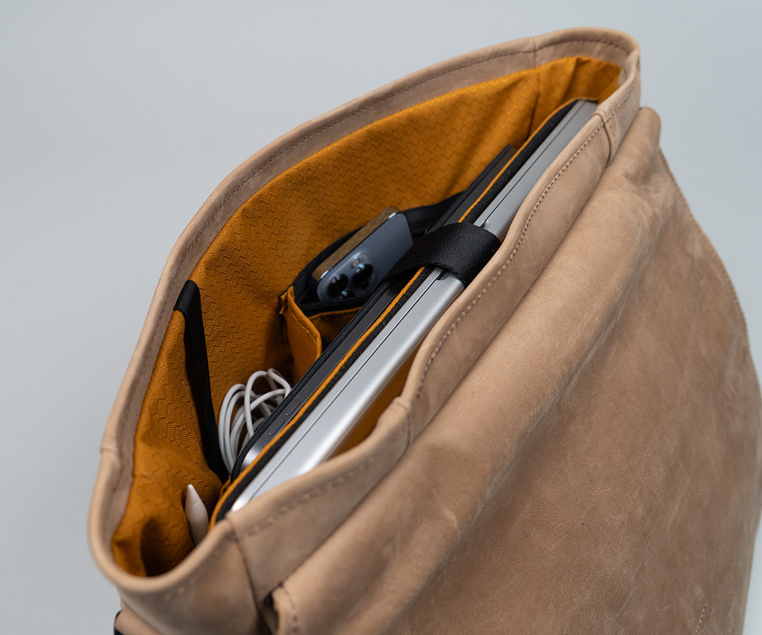Two deep organizational pockets (one zips closed) 