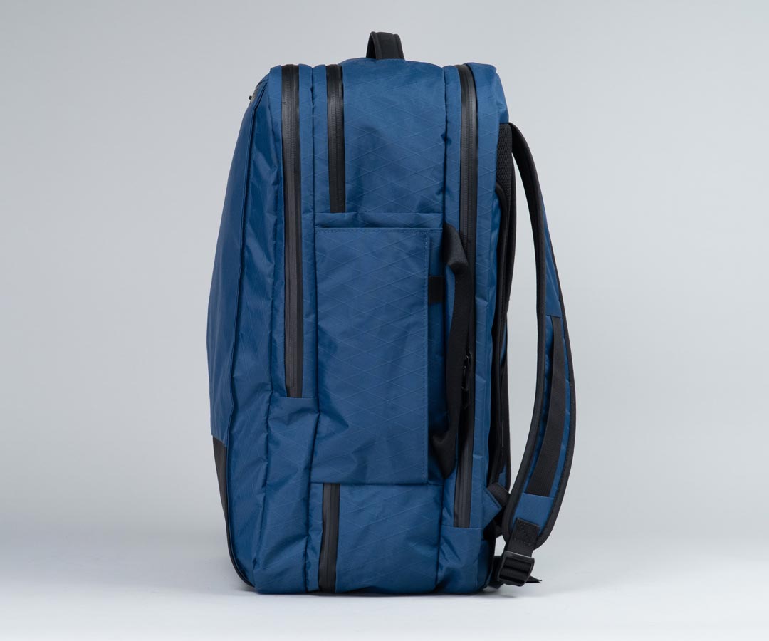 Expandable side water bottle pocket