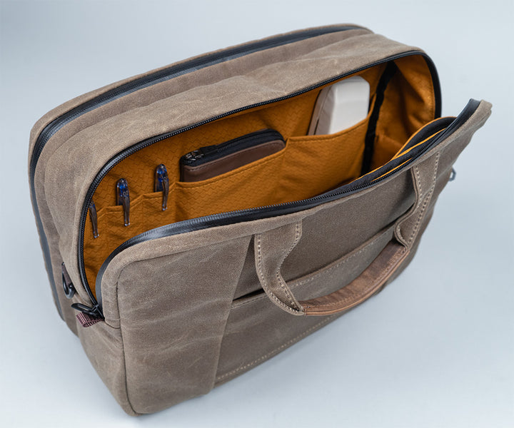 Water-resistant double zippers open  halfway for a wide opening