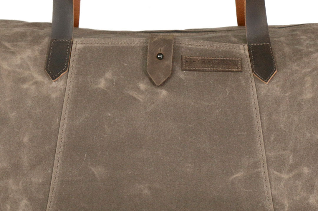 Easy-access front pocket with button closure 