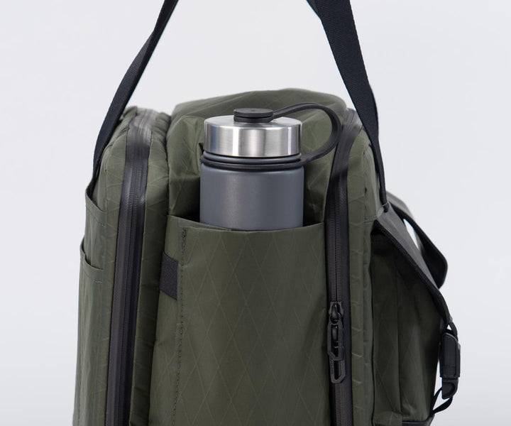 Two expandable deep side pockets fits wide water bottles