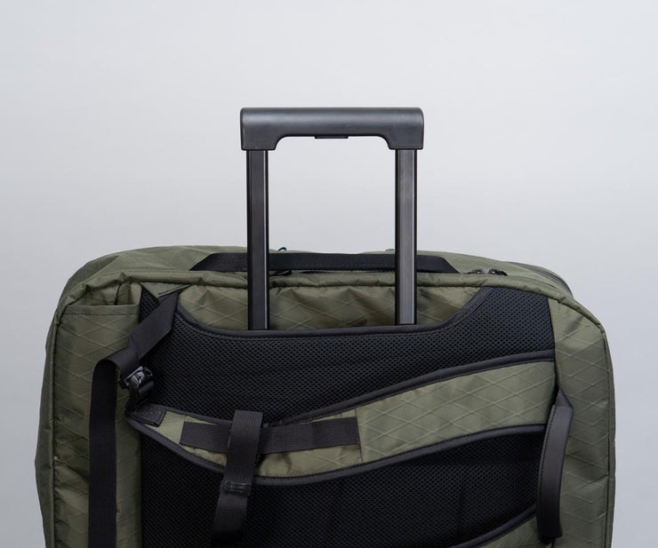 Fits horizontally on top of luggage handles