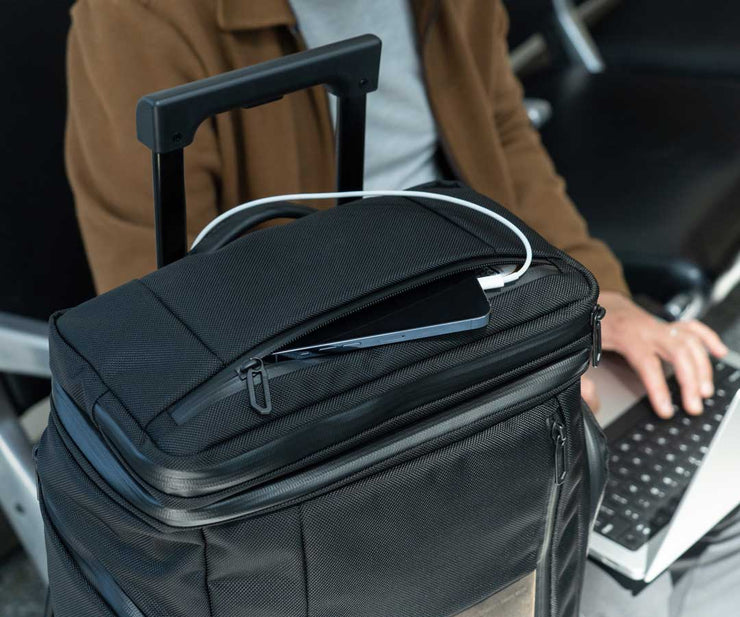Charge your phone while it stays safely in the top pocket