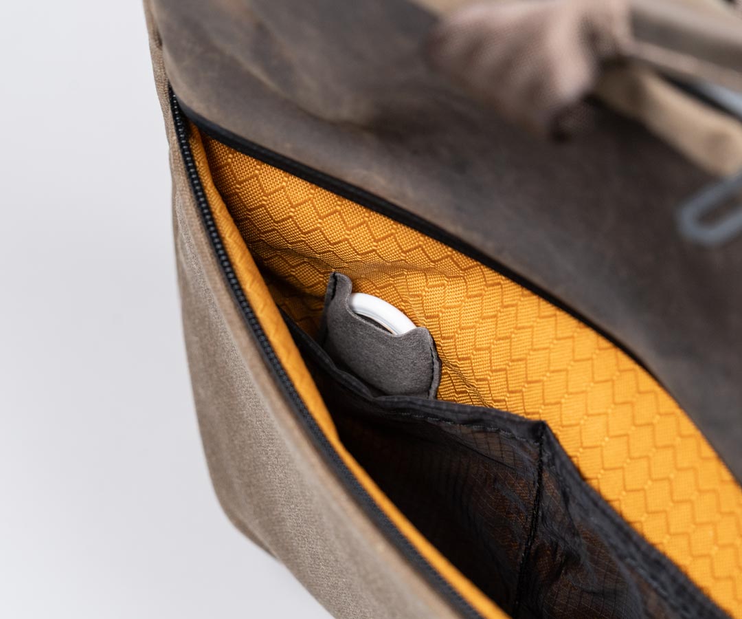 Hidden AirTag pocket in Ultrasuede