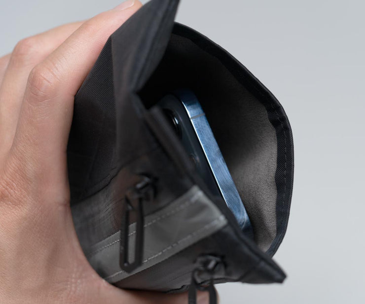 Separate Ultrasuede®-lined phone pocket 