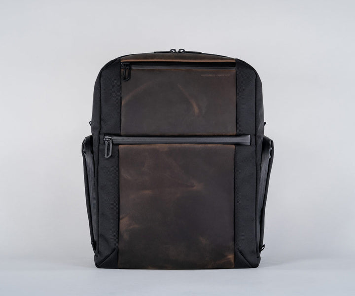 Front panel has two full-grain leather pockets for easy access