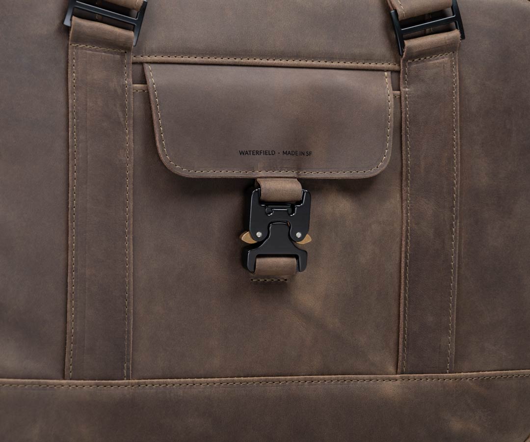 Paragliding buckle secures contents