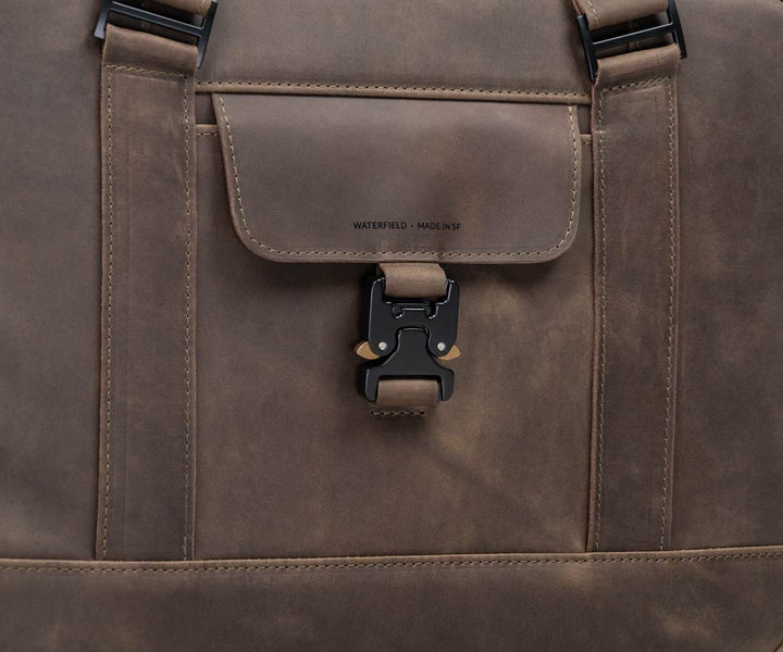 Paragliding buckle secures contents