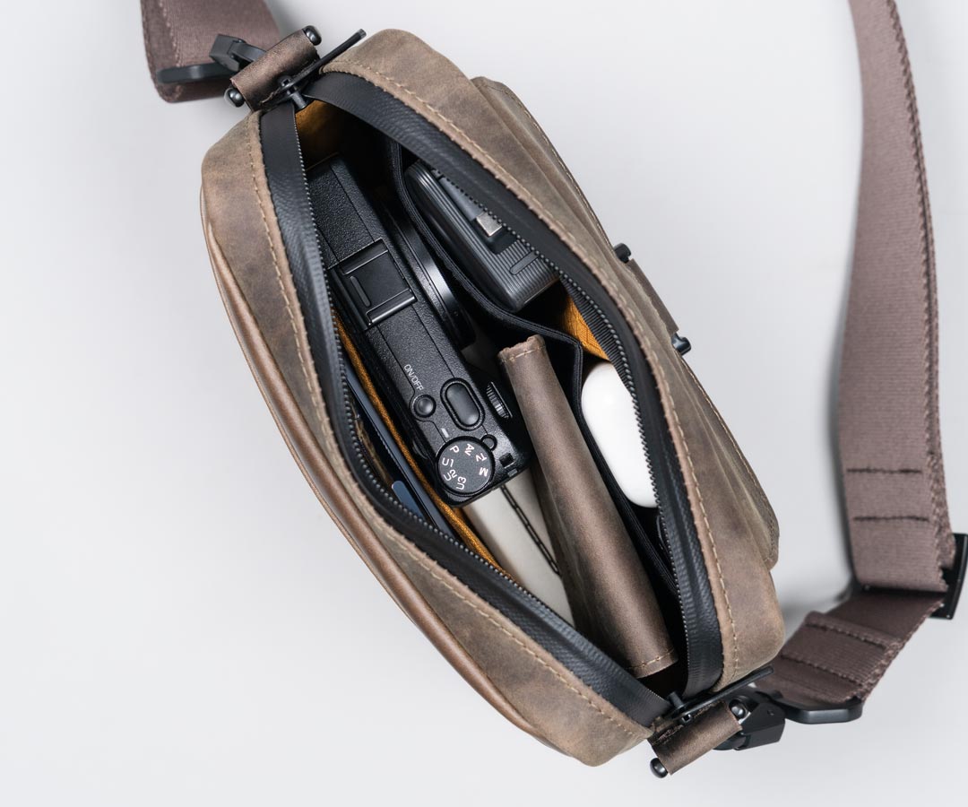 designer leather sling backpack Womens Chest Bag With Headphone Cable Hole Sling Pack For Women to choice for commuting The Sling Backpack