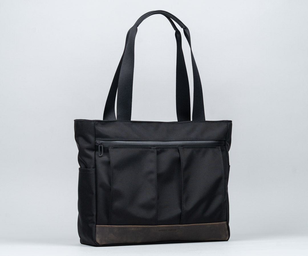 In traditional Waxed Canvas or Ballistic Nylon