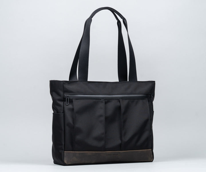 In traditional Waxed Canvas or Ballistic Nylon