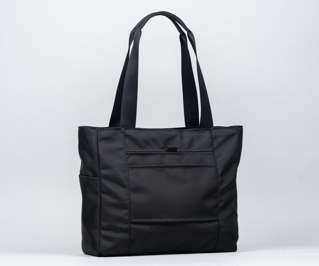 Back: Discreet pocket and suitcase slot