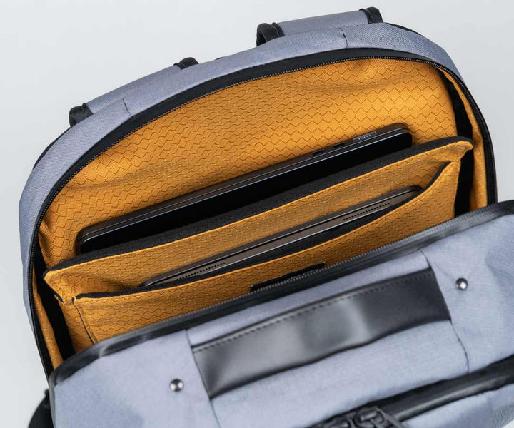 Two integrated padded pockets for a laptop and tablet