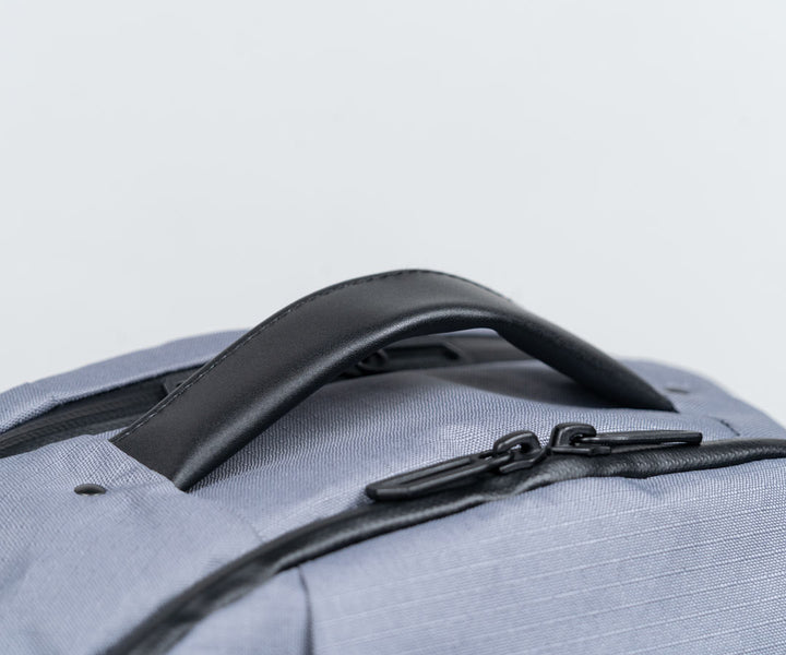 Full-grain leather reinforced grab handle