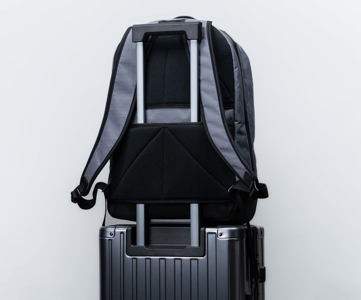 Suitcase handle passthrough slot