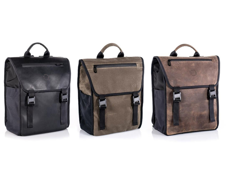  In black ballistic nylon + full-grain  leather,  all-waxed canvas