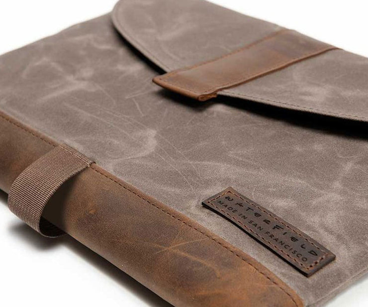 Waxed Canvas with full-grain leather accents