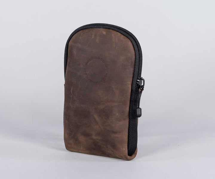 In distressed full-grain leather with water-resistant zipper