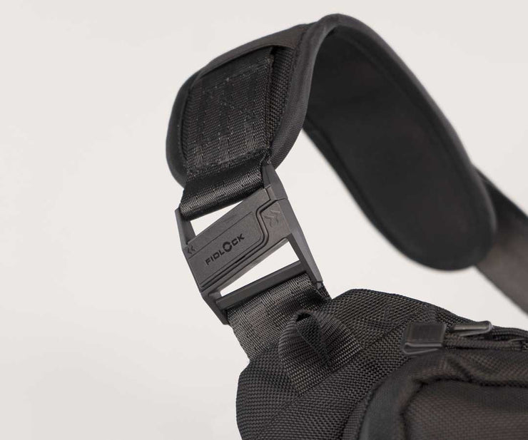 Grippy padding stabilizes strap on shoulder