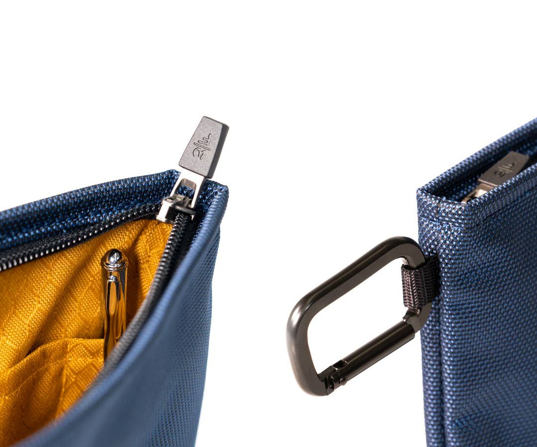 Includes carabiner and travel pen. 