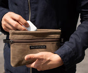 OPTIONAL: Tech Pocket for storing small electronics (sold separately)