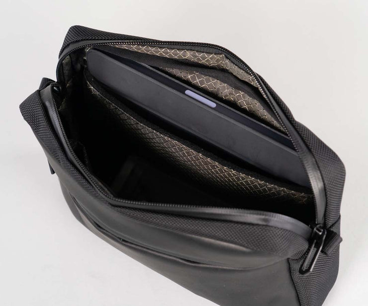 Padded side pocket holds an iPad mini or similar-sized tablet