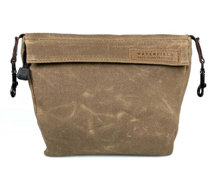 The PiggyBack for accessories comes in Waxed Canvas and Ballistic Nylon