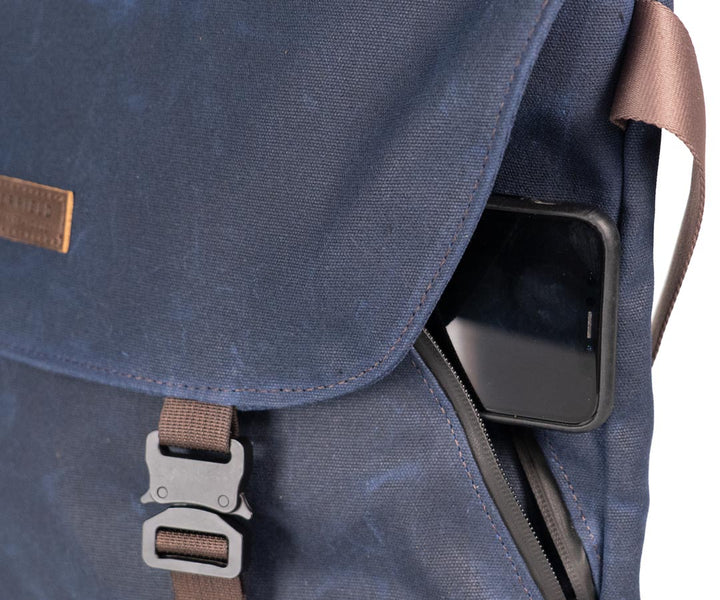 Angled front pocket for easy access without opening the flap