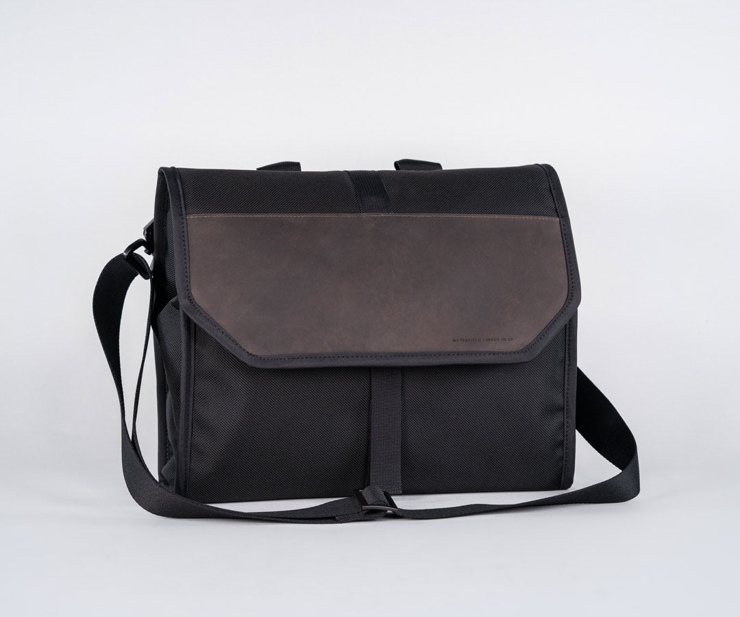 Full-grain leather flap covers additional pockets.