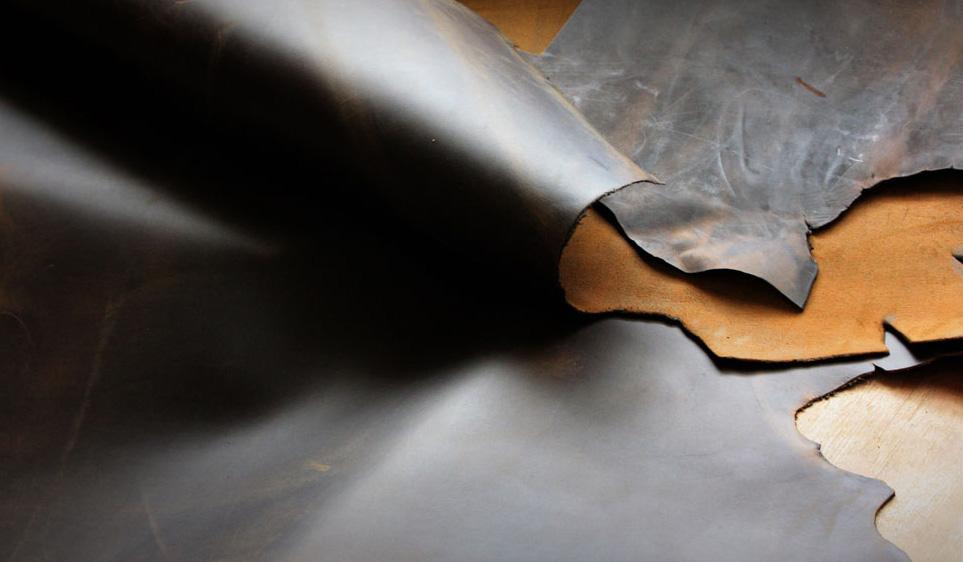 Close-up of premium full grain leather sheets used for crafting high-quality bags